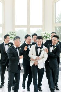 groom with groomsmen before wedding