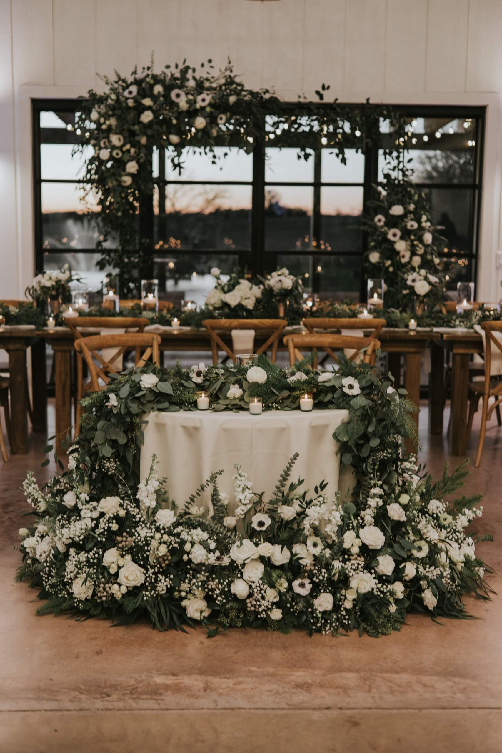 Green and white floral design at wedding reception by Edwards Floral Design
