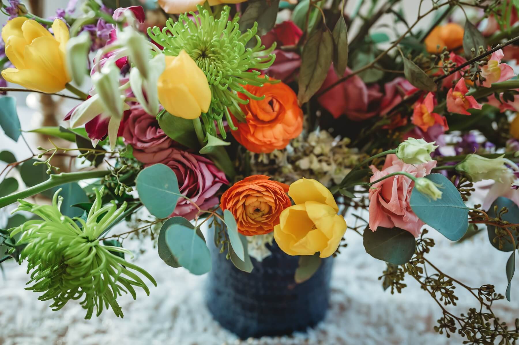 Colorful and whimsical centerpieces by Vine and Branches in post about wedding florists in Dallas