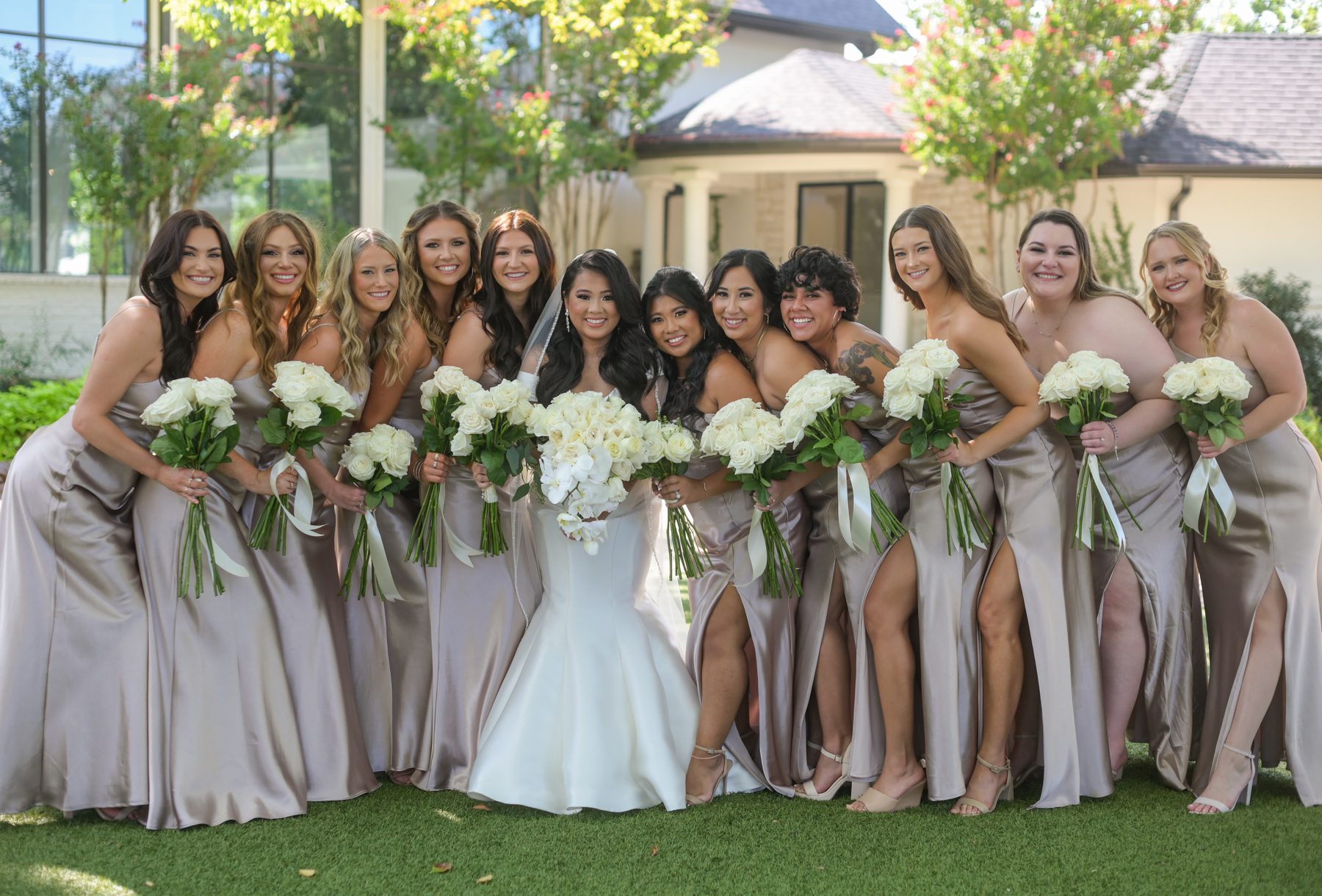 Bride with bridesmaids in satin dresses at Brighton Abbey