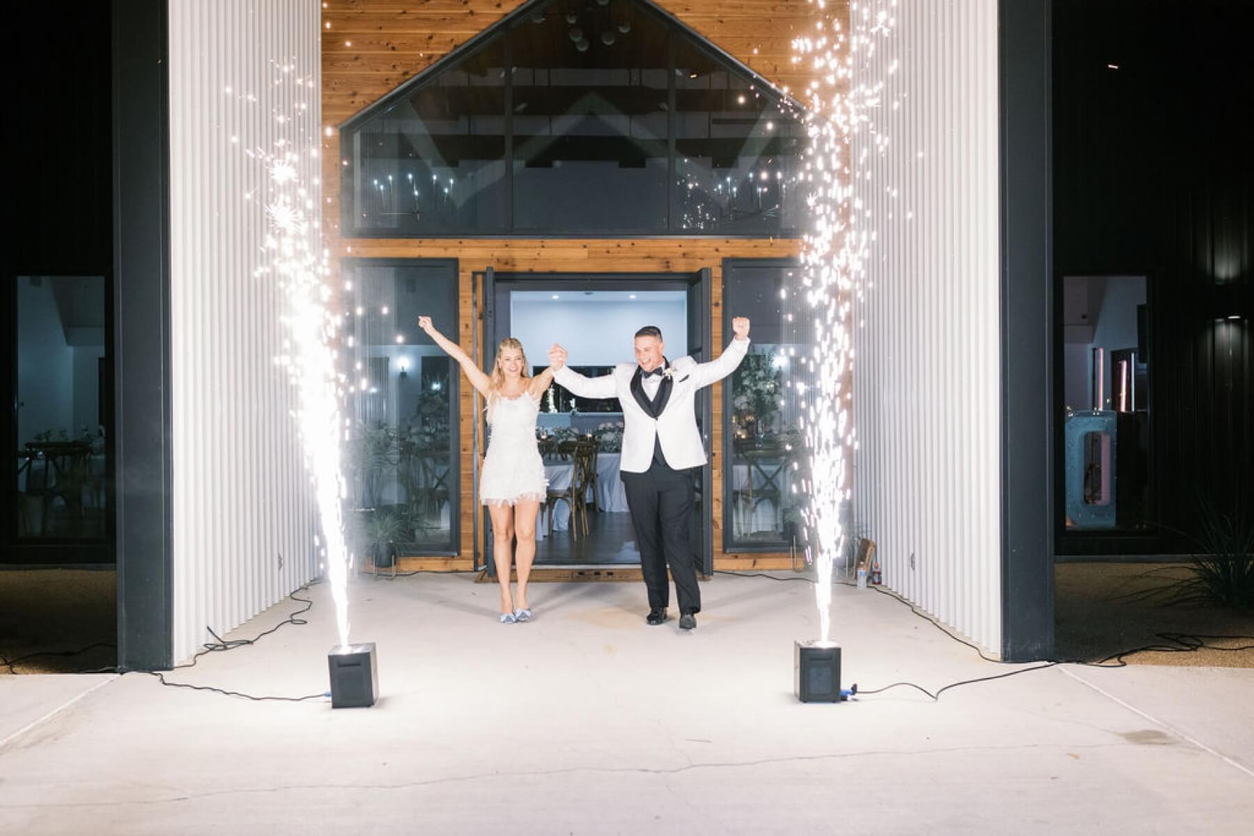 Bride and groom exiting ceremony with cold sparks at Union House TX