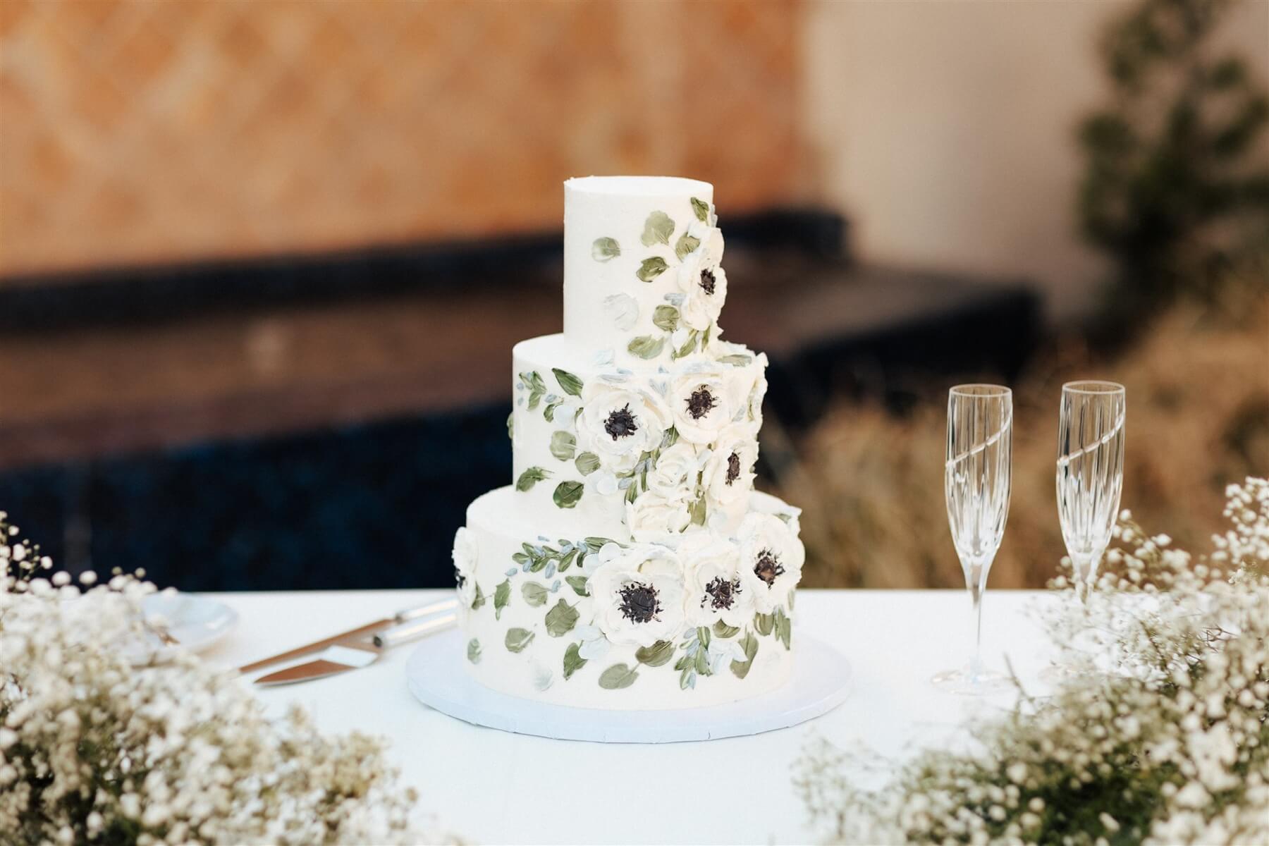 Three tier wedding cake with handprinted details