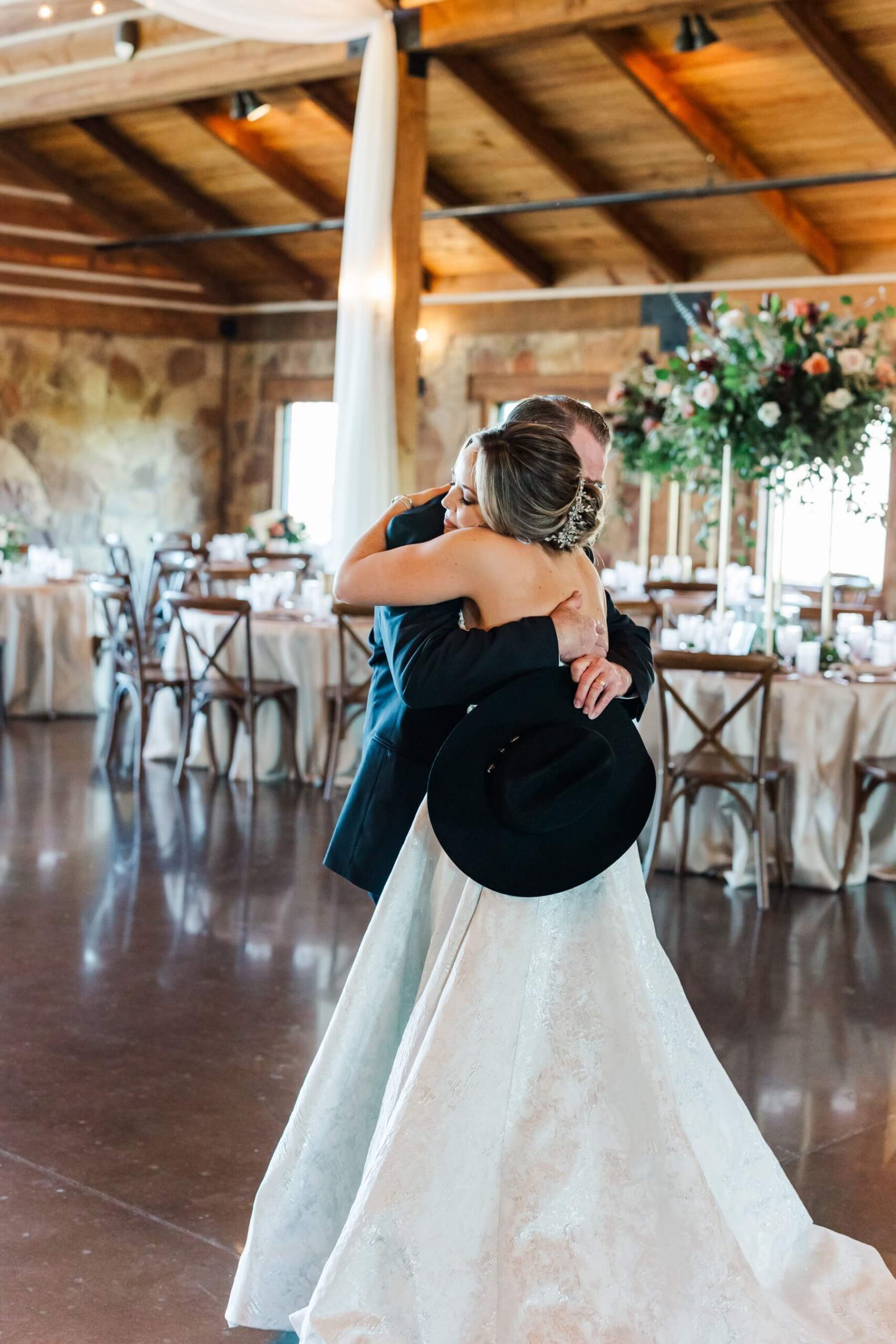 Bride hugging dad during first look at The Springs in Denton