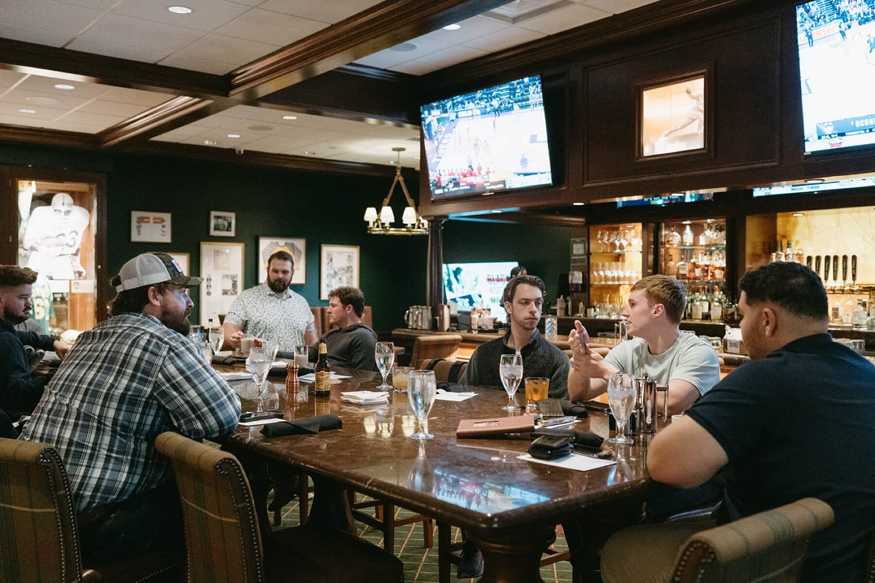 Groom and groomsmen at the bar in the Fort Worth Club