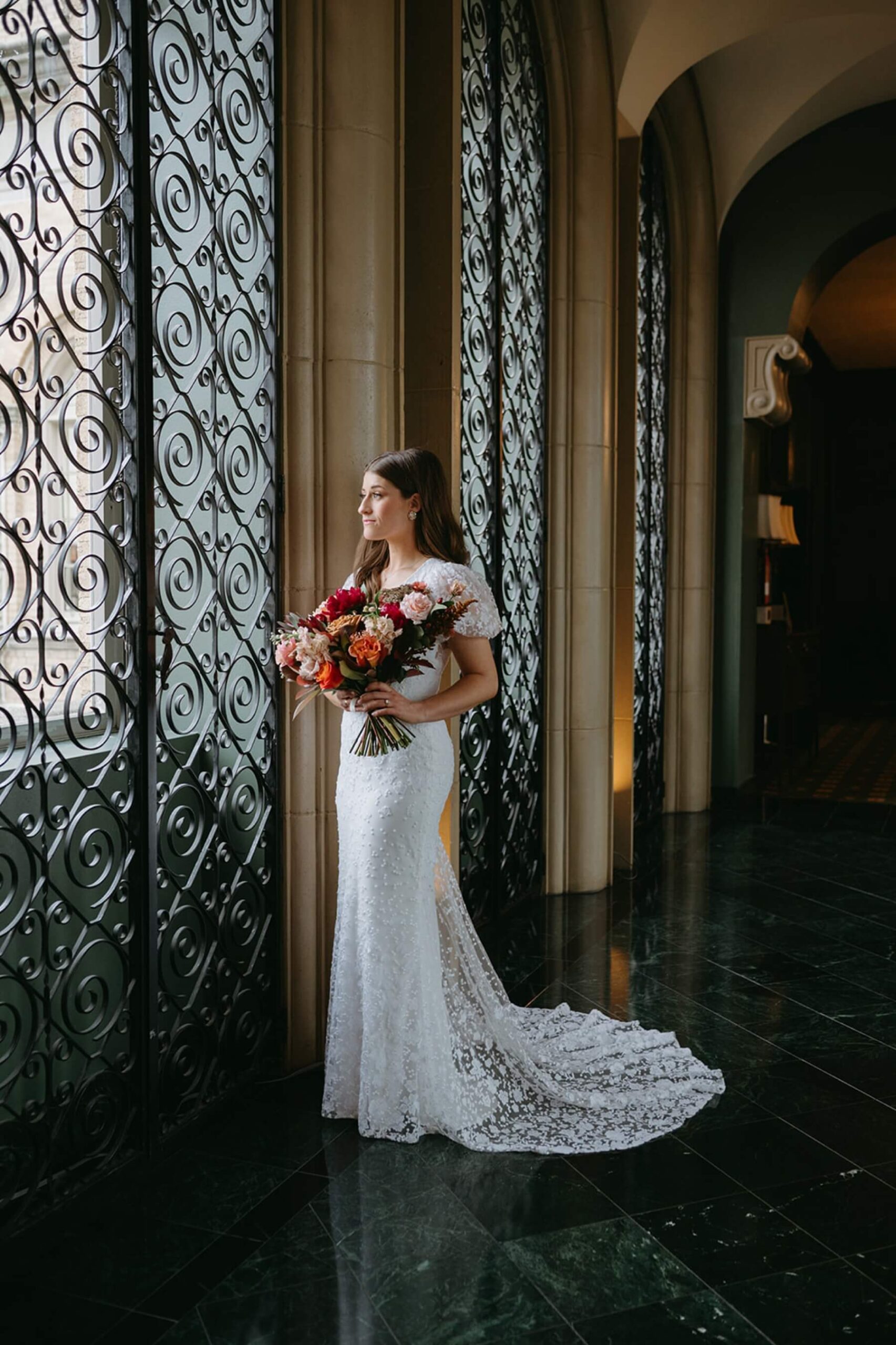 Bride standing in window of the Fort Worth Club