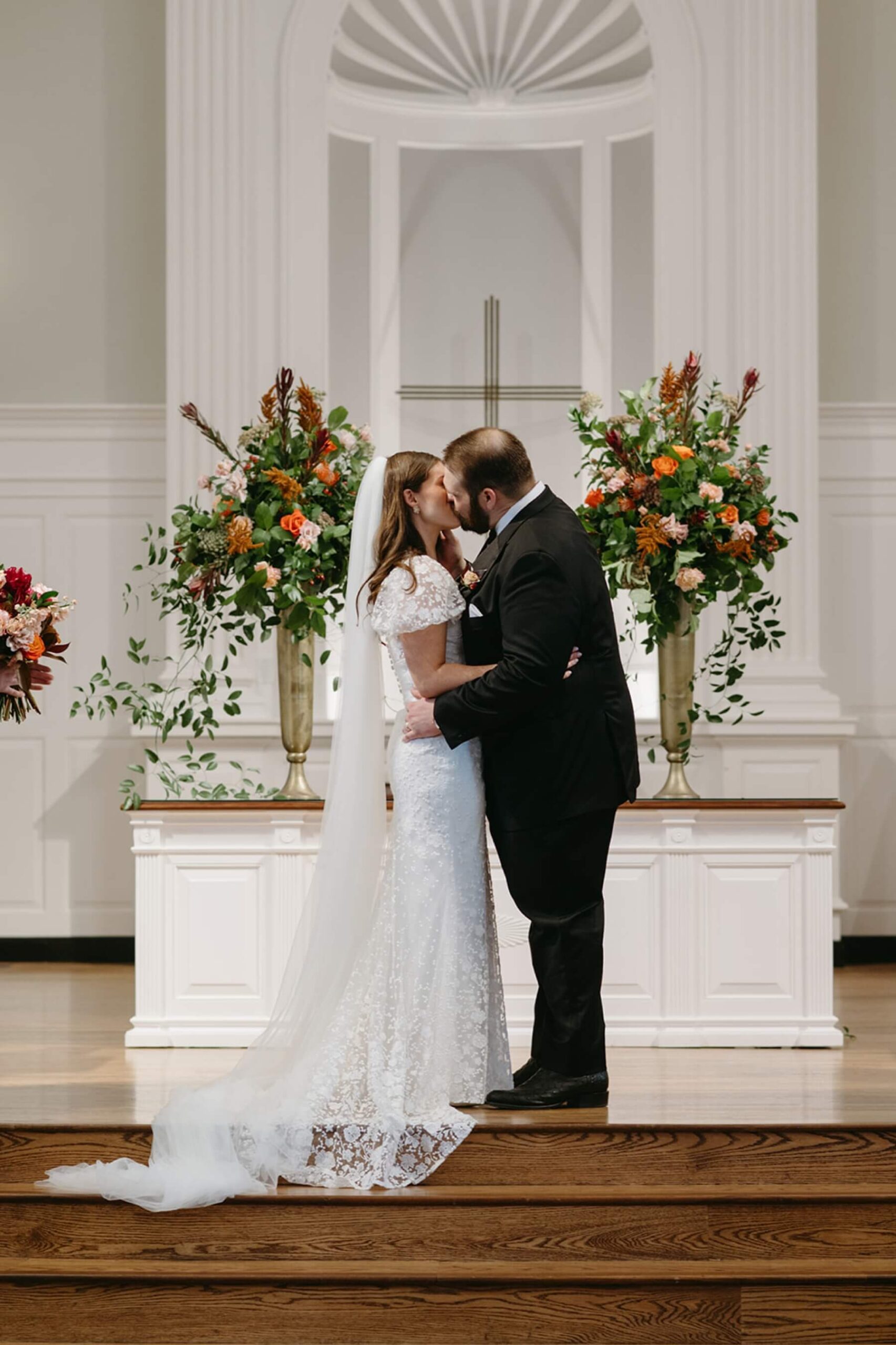 Bride and groom kissing at Robert Carr Chapel