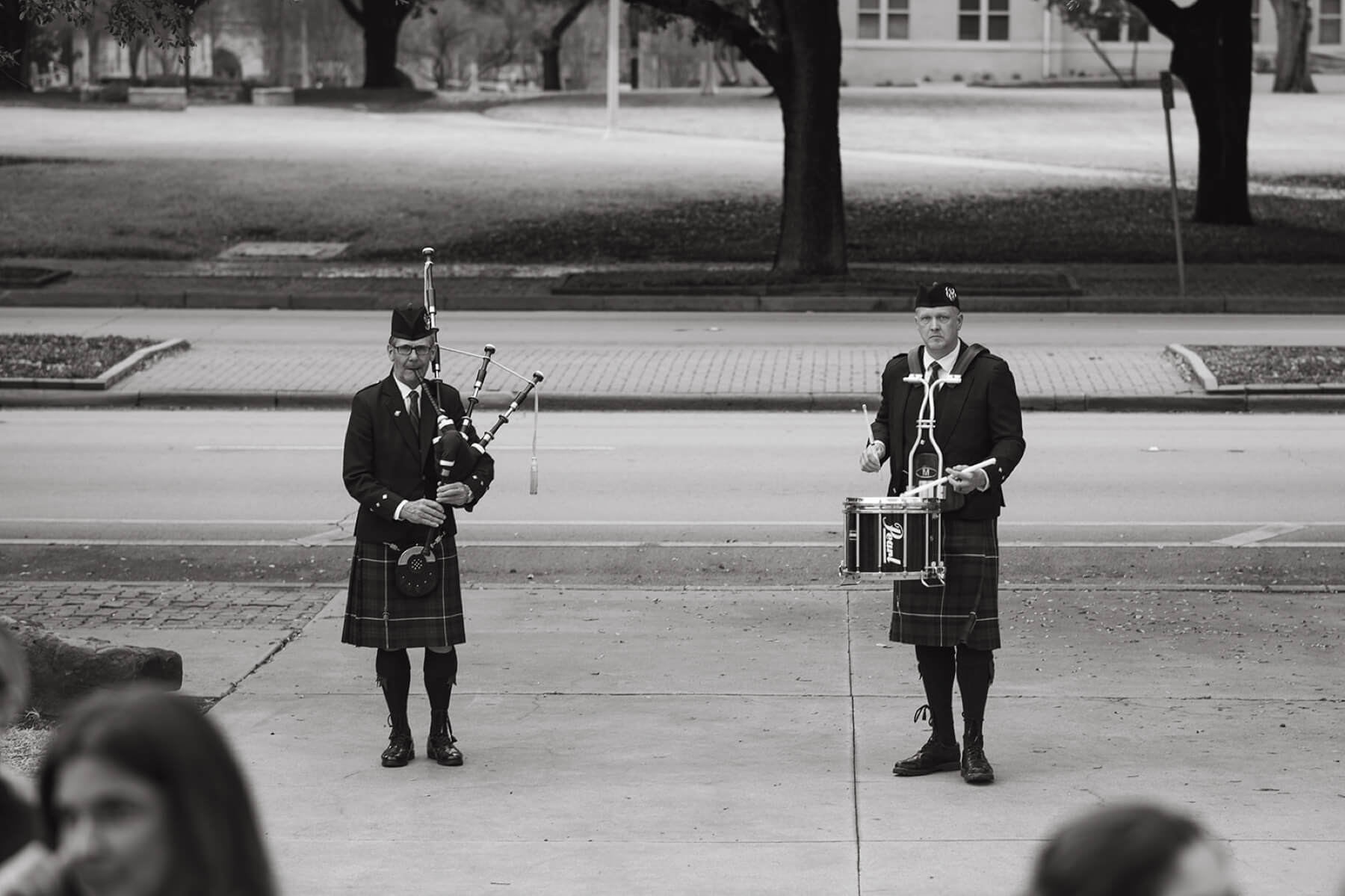 Bagpiper and drummer outside Robert Carr Chapel