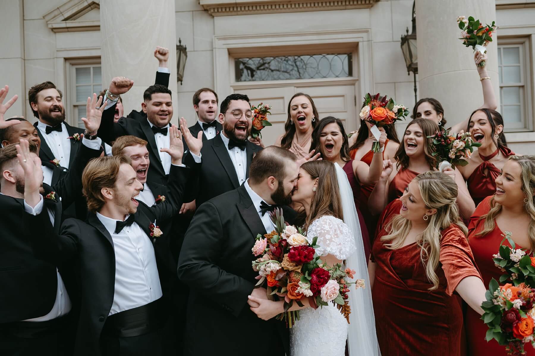 Bride and groom with wedding party on steps of Robert Carr Chapel