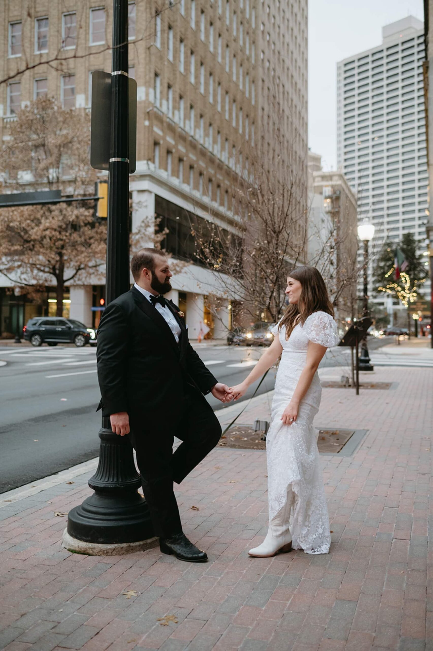 Bride and groom walking in downtown Fort Worth