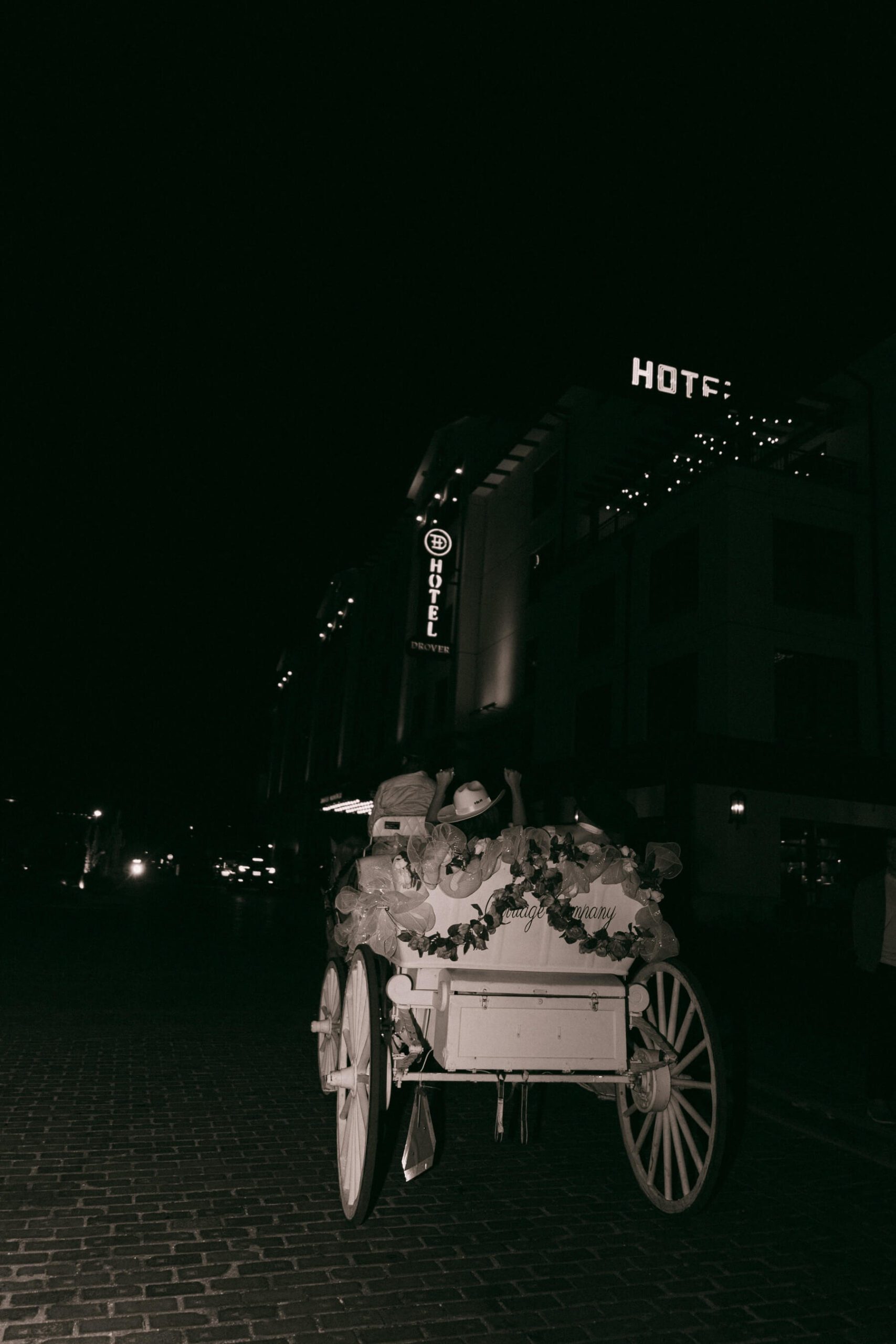 Bride and groom exiting in carriage from Fort Worth wedding