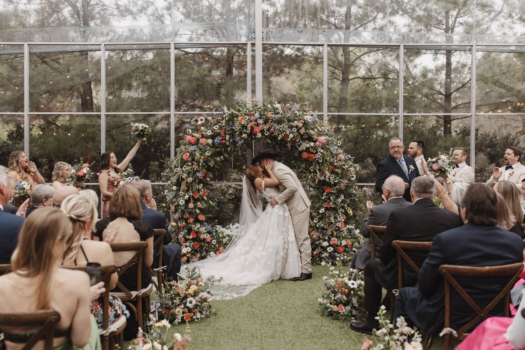 Bride and groom kissing at Fort Worth wedding ceremony 