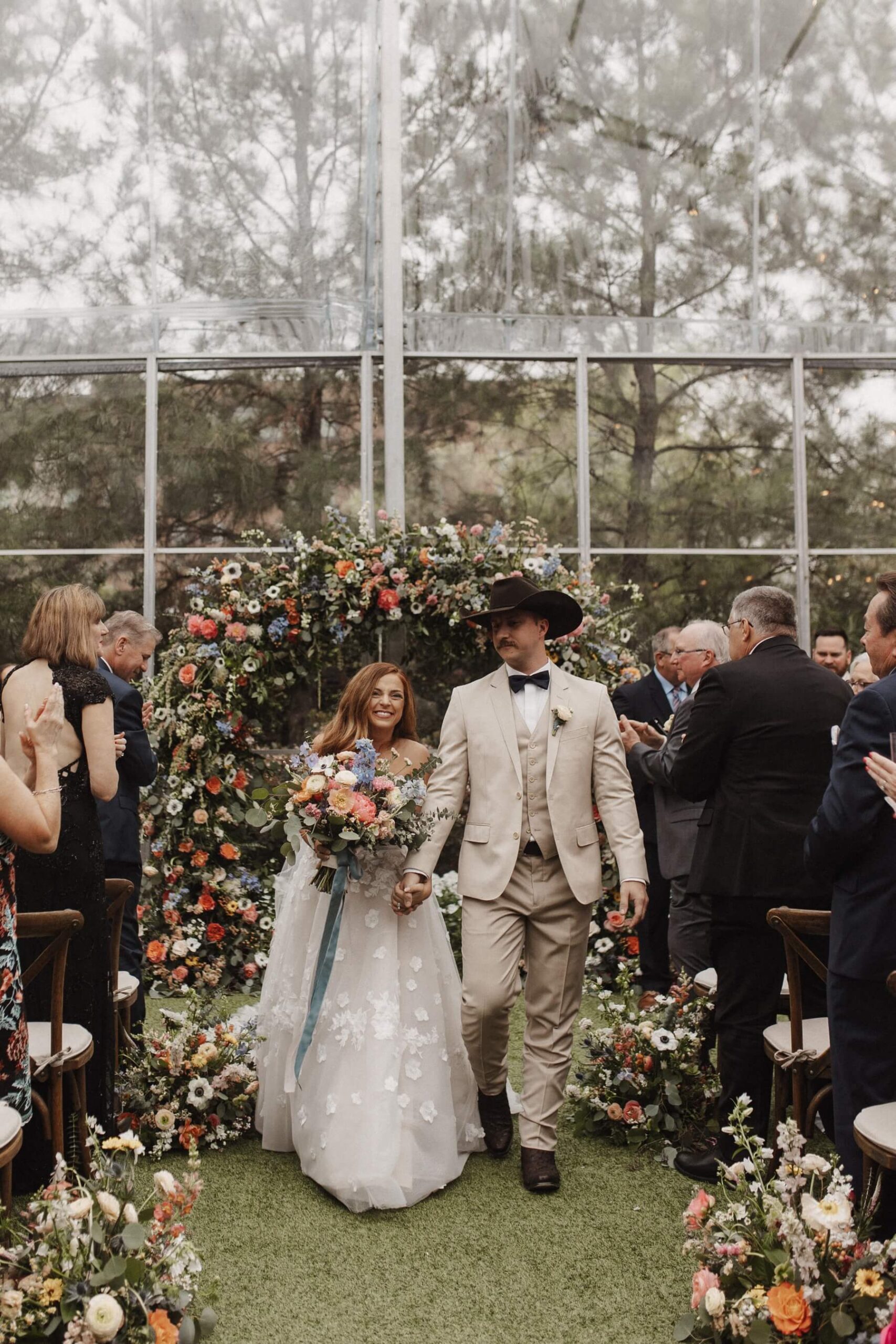 Bride and groom walking down the aisle at Fort Worth wedding