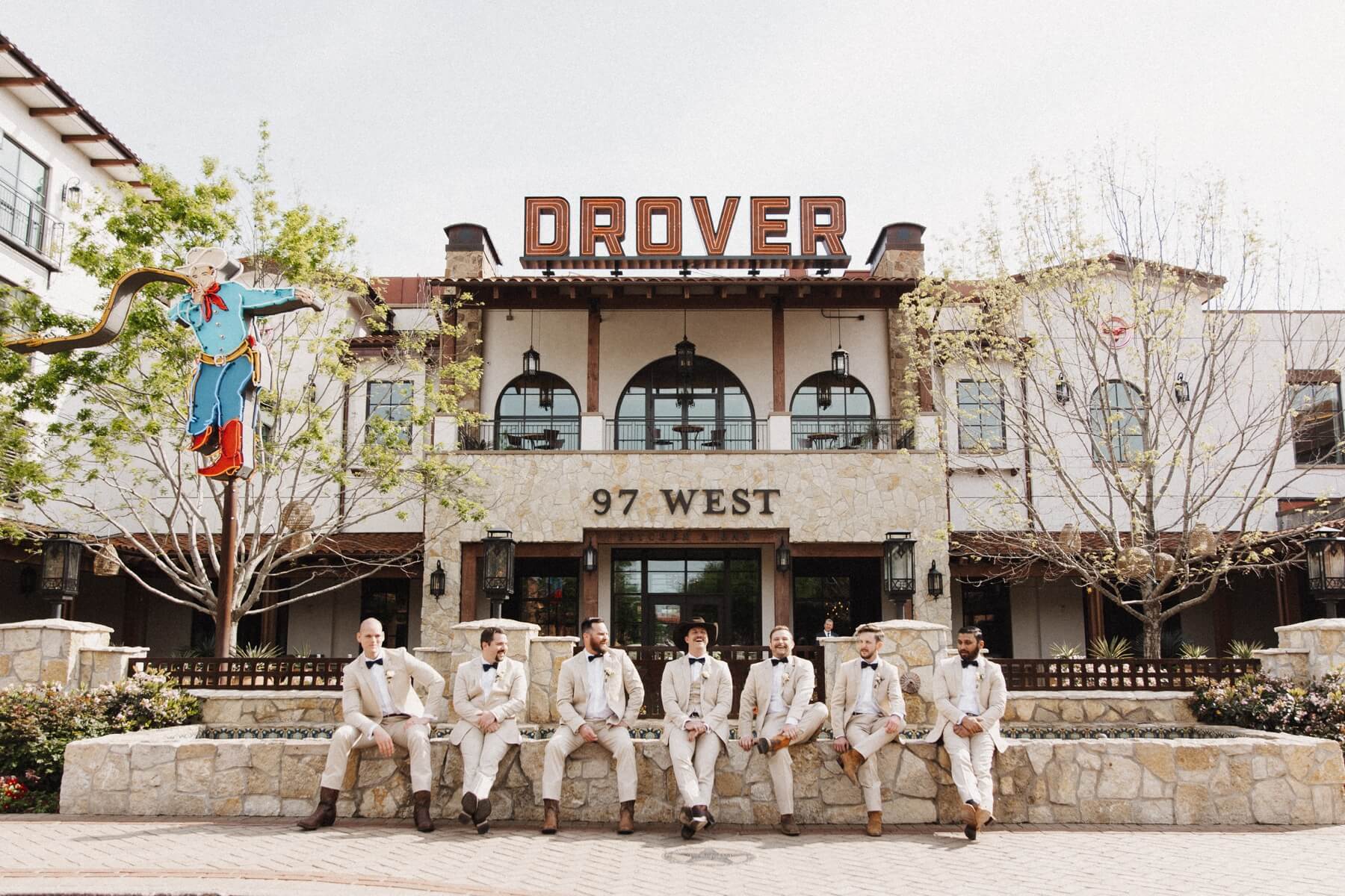 Groom and groomsmen in front of Hotel Drover